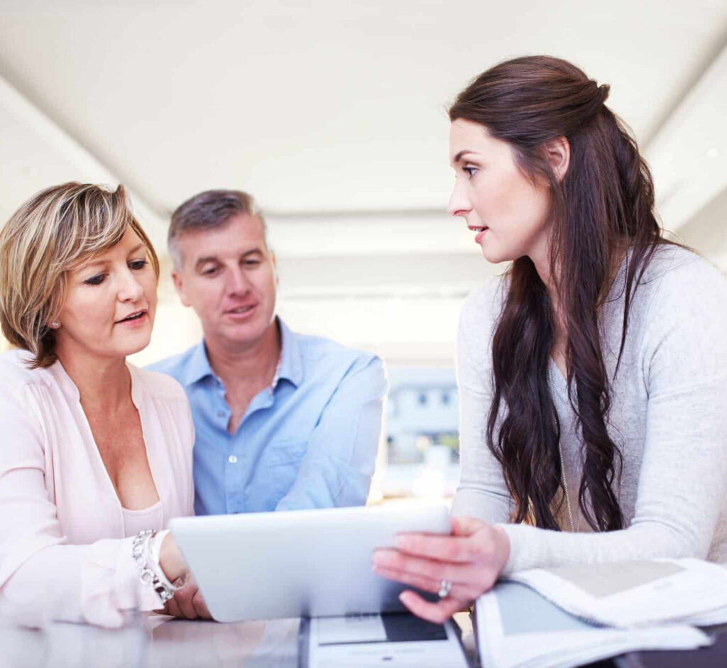 woman conducting an in-home consultation with couple